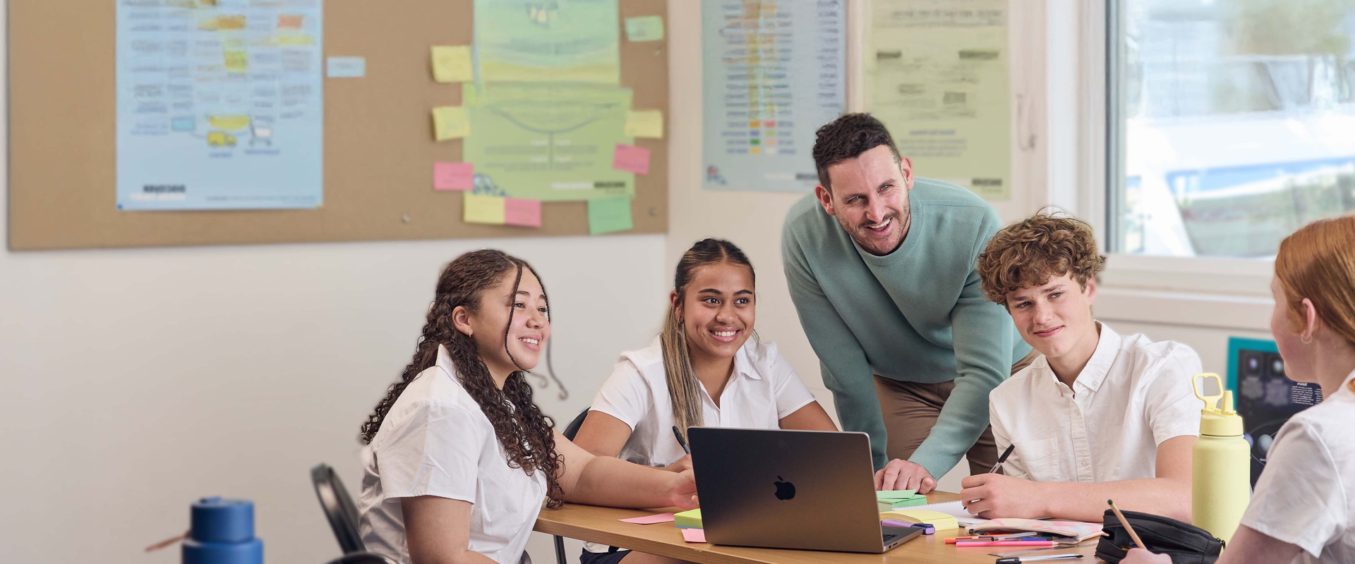 Teacher with group of secondary school students