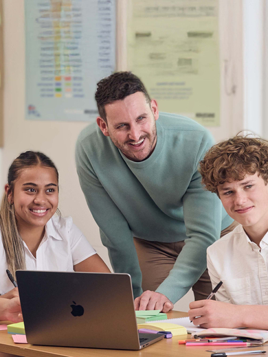 Teacher with group of secondary school students